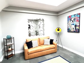 Lounge: Artistic decor and natural light create a vibrant space to unwind and socialize!
