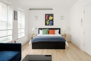 Bedroom with king bed, sofa bed and smart TV for a cosy, flexible stay