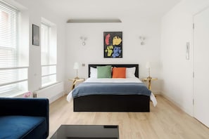 Bedroom with king bed, sofa bed and smart TV for a cosy, flexible stay