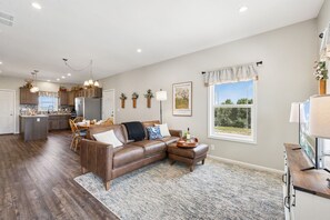 Living Room with Queen Sleeper Sofa, Electric Fireplace, and Smart TV