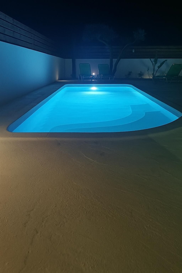Sparkling night-time view of the pool – peaceful and serene.