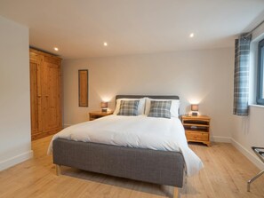 King size bed, bedside cabinets and lamps and large wardrobe