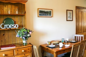 Dining area with dresser, table and chairs