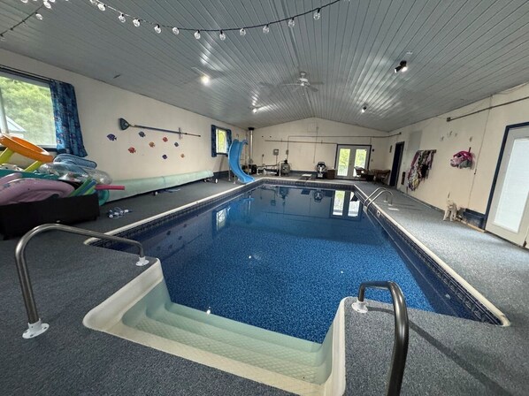 Indoor pool with slide and diving board