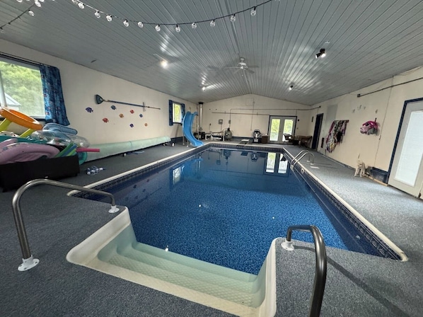 Indoor pool with slide and diving board