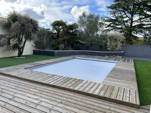 Piscine et volet roulant immergé