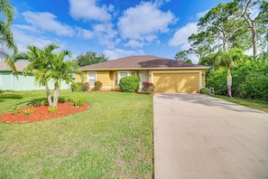 Property Exterior | Screened-In Lanai | Private Pool | Spacious Yard