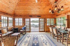 Sunroom | 1st Floor | Lake & Mountain Views | Deck Access | Dining Area