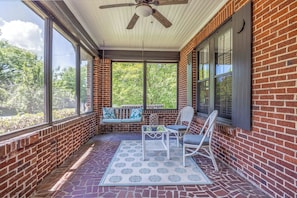 Relax and unwind on the cozy front porch swing
