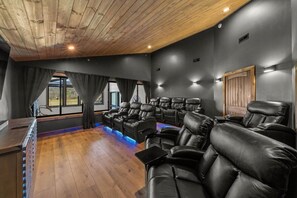 Enjoy a cozy movie night in Dazzling Cabin's home theater