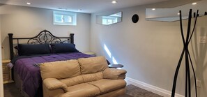 Coat rack is next to door for jackets, coats or handbags