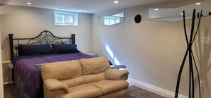 Coat rack is next to door for jackets, coats or handbags
