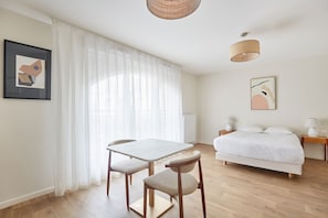 Thoughtfully arranged studio with natural light and minimalist design, ideal for relaxing between city adventures.