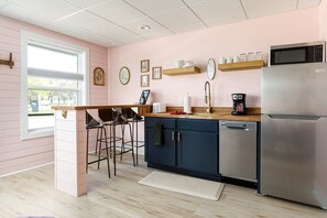 Stylish kitchenette and dining bar for your convenience. 🍽️
