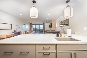 Prepare a meal while catching up on your day of adventure in this beautifully open concept condo | Main Level