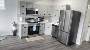 kitchen cupboards labeled for easy fine
