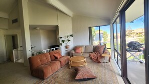 Open plan living, vaulted ceilings, opening onto balcony & BBQ
