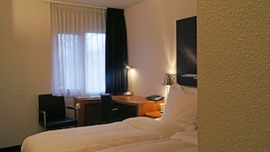 Unit with 2 Single beds. Exact unit will be assigned upon arrival. Views, colors, and decor may vary.