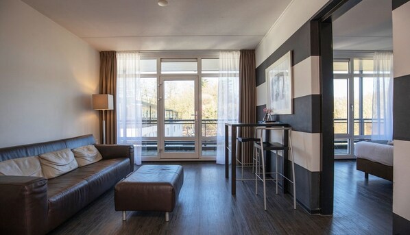 Living area. Exact unit will be assigned upon arrival. Views, colors, and decor may vary.