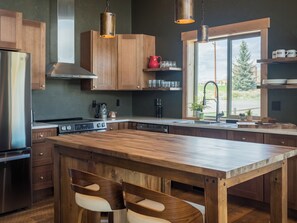 Thoughtfully designed for real moments—gather at the island for coffee, conversation, or a fresh loaf right out of the oven. This kitchen makes hosting feel effortless.