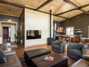 Gather your loved ones in this soaring great room, where rustic-modern design meets easy conversation. Whether you're reconnecting over coffee, game night, or Wyoming views, this space invites you to slow down and enjoy time together.
