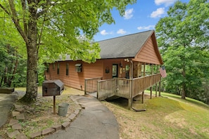 Welcome to Mama Bear Cabin—a charming mountain retreat where rustic charm meets modern comfort, all nestled beneath a canopy of green.