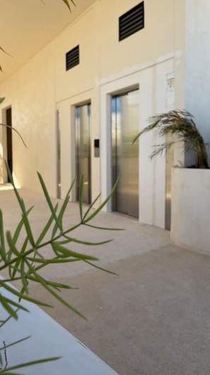Elevator access to upper floors and rooftop terrace for convenient mobility.
