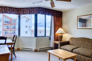 Spacious living area with pull out sofa | Listed with @BookTraverse