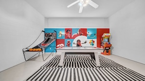 Game room with air hockey, basketball hop arcade, and arcade video games