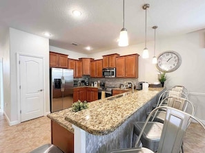 kitchen countertop with chairs