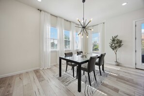 Open layout w/ dining area—great for meals, gatherings, & cozy vibes.