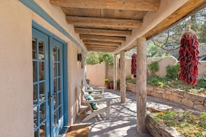 Relax in the shade with vibrant peppers and gentle breezes in Santa Fe’s charm!