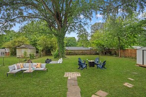 Spacious backyard with area for firepit and patio lounge