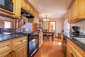 Bright and spacious, this kitchen seamlessly transitions into a dining space, perfect for sharing meals and making memories together with loved ones.