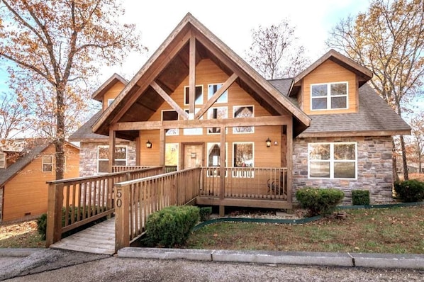 Experience luxury and comfort at this stunning Branson condo featuring an inviting front porch and beautiful architecture, perfect for family gatherings.
