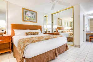 A serene bedroom adorned with elegant furnishings, reflecting natural light, and complemented by tasteful artwork.