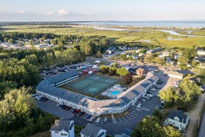 Bird’s-eye view of the property grounds and surrounding green spaces — get a full sense of this peaceful retreat.