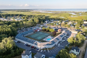 Bird’s-eye view of the property grounds and surrounding green spaces — get a full sense of this peaceful retreat.