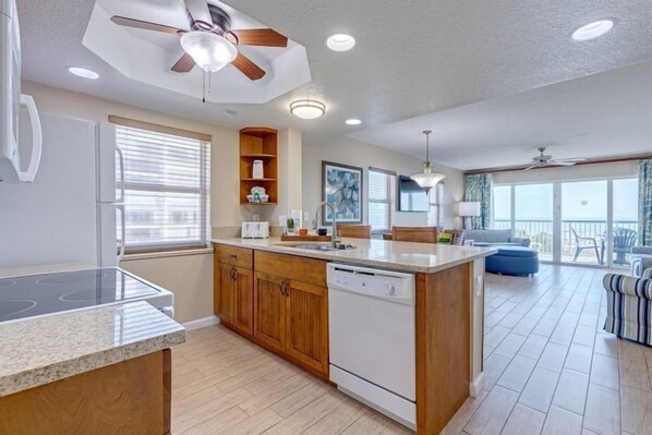 This full kitchen invites you to prepare meals while basking in the natural light and ocean breeze.