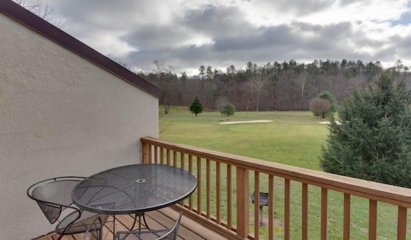 Relax on your private balcony with a cozy table set for two, offering serene views of the surrounding landscape—ideal for morning coffee or evening star-gazing.