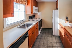 A fully-equipped kitchen featuring modern appliances and ample counter space, ideal for preparing meals during your stay.