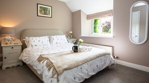 The view from bedroom one is framed in wisteria