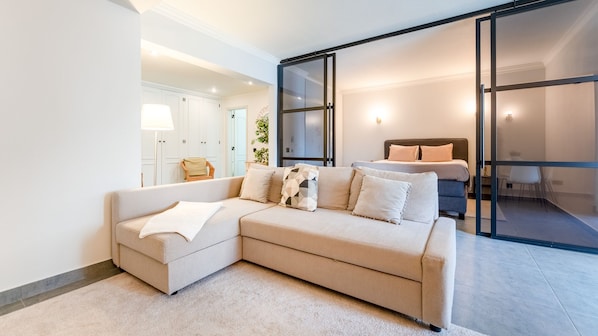 Step into a bright, airy living space that seamlessly connects to the bedroom, designed with modern comfort and subtle elegance to make you feel right at home.
#ModernLiving #OpenPlanDesign #ComfortAndStyle #ApartmentGoals #LovelyStayPortugal