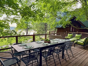 Unwind on the spacious 1,250 sq ft shaded deck—perfect for sipping afternoon drinks, chatting with friends, or napping in the breeze—all while soaking in the peaceful views of Lake Ann.