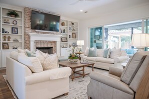 Spacious living room with ample seating for the family.