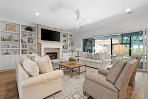 Spacious living room with ample seating for the family.