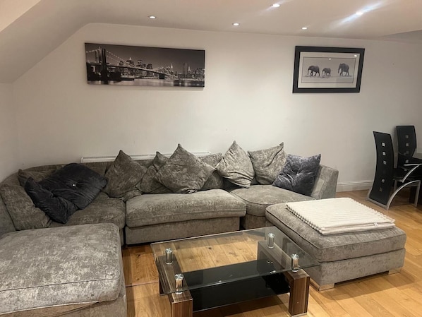 Large sofa, lots of seating.