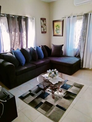 large corner sofa with large windows for lighting
