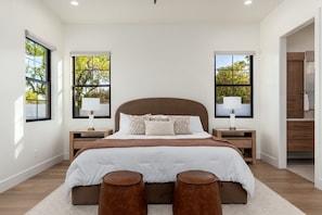 Master bedroom with king size bed w/ TV and bathroom