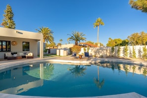 Enjoy the sun under the large pool